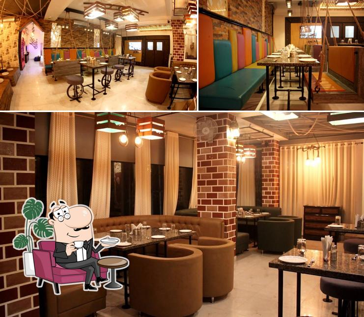 This is the image displaying interior and dining table at Open House Caffé