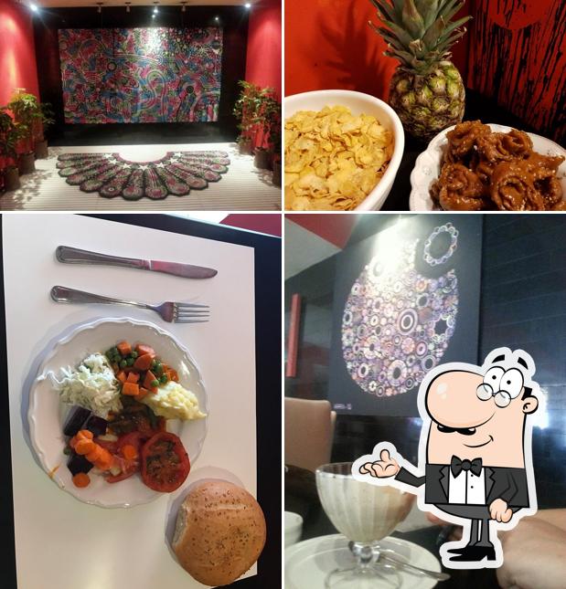 Installez-vous à l'une des tables de Café Restaurant Les Artistes