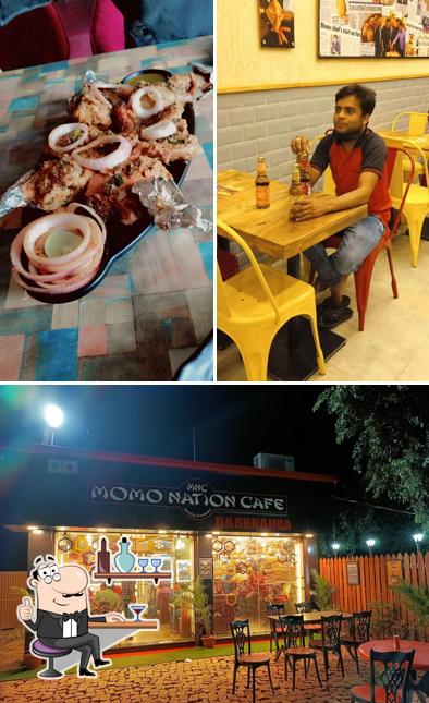 Take a seat at one of the tables at Momo Nation Cafe, Darbhanga