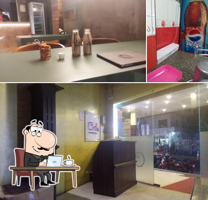 The picture of interior and beverage at Chillies Family Restaurant