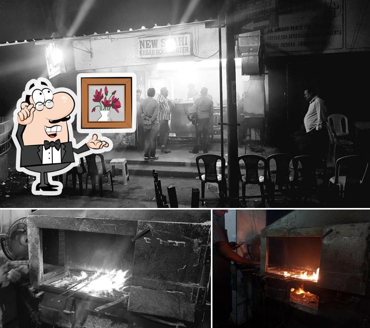 Take a seat at one of the tables at New SHAHI KABAB ROLLS CENTRE