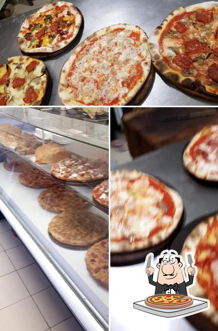 A Pizzeria Spiga D'Oro, puoi prenderti una bella pizza