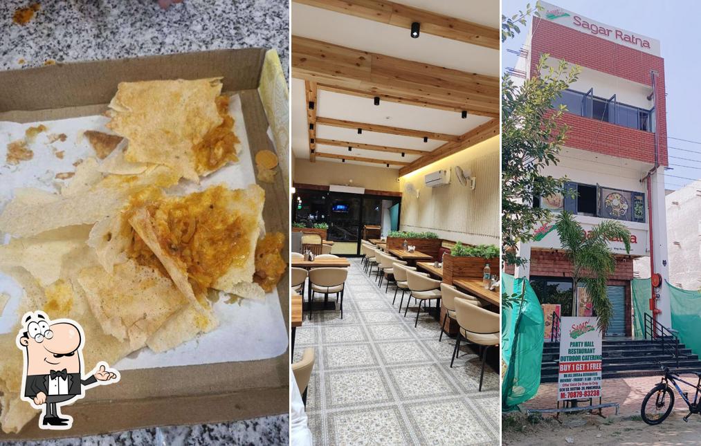 Take a seat at one of the tables at Sagar Ratna - Restaurant - Party Hall - Outdoor Catering