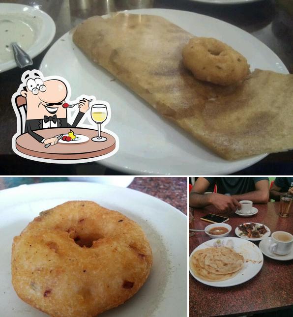 Among different things one can find food and dining table at Indian Coffee House