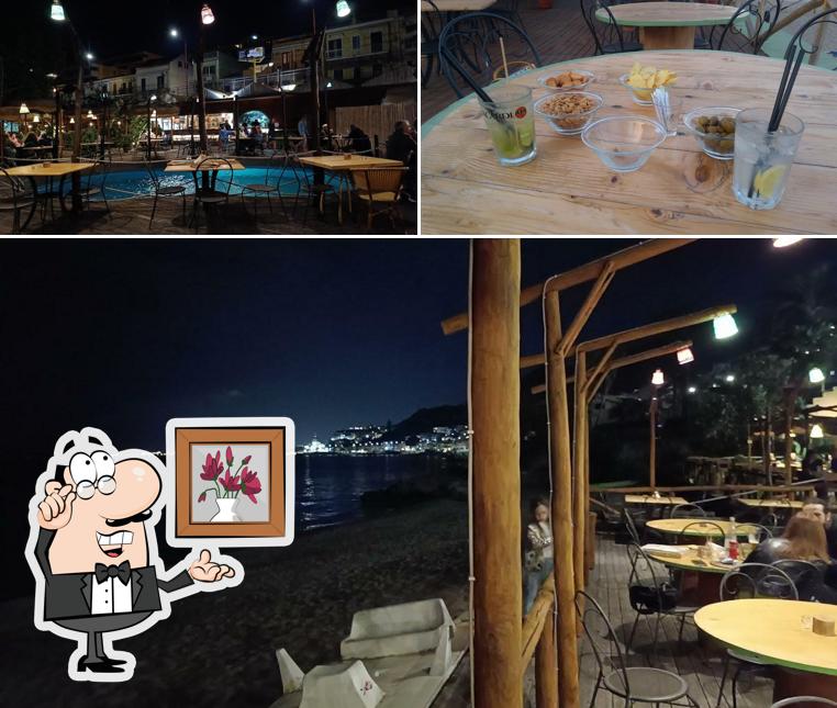 Siediti a un tavolo di Kibanda Afro Beach Bar