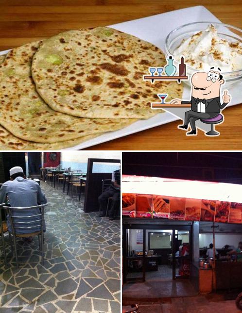 This is the picture showing interior and pizza at Muqim Restaurant