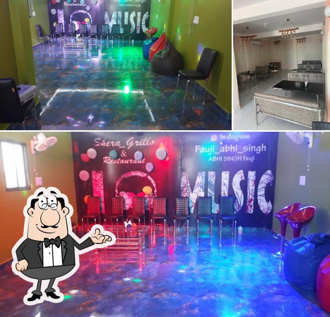 Take a seat at one of the tables at SHERA GRILLS RESTAURANT & PARTY HALL