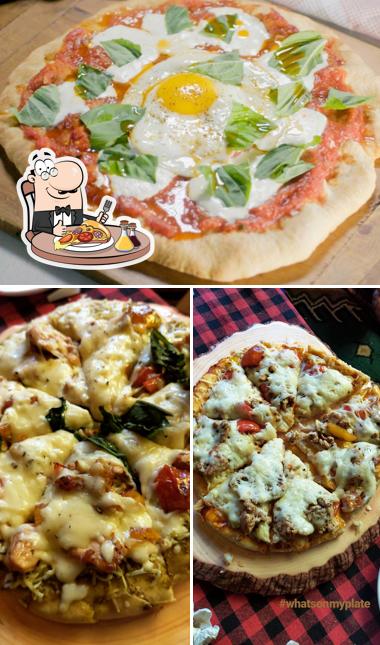Order pizza at Club Nirvana cafe And Stays