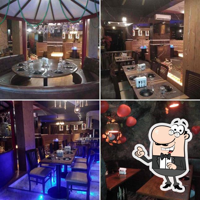 Take a seat at one of the tables at The Oceanus Theme Restaurant & Bar