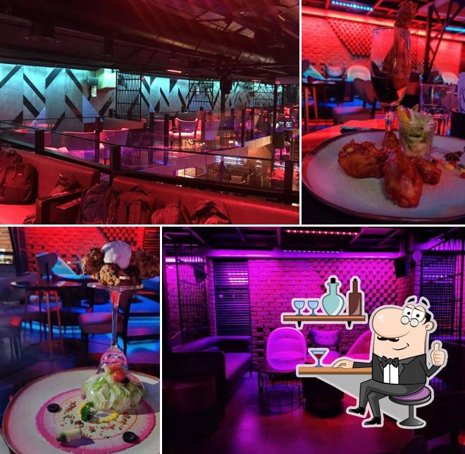 Take a seat at one of the tables at WAREHOUSE LOUNGE