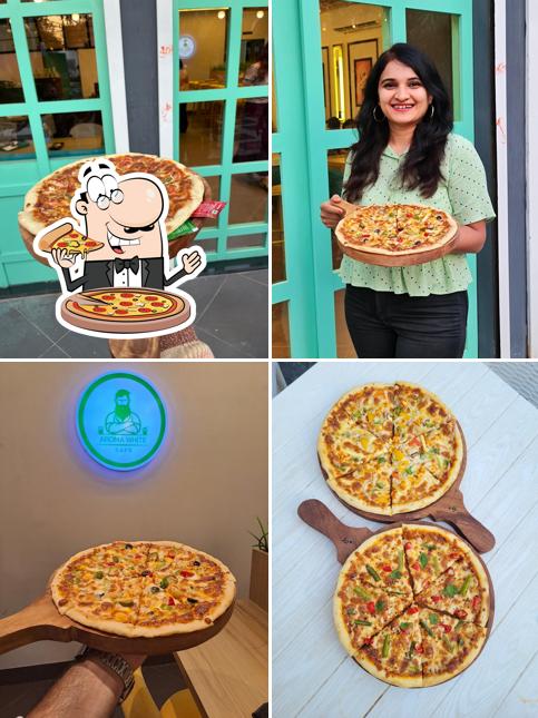 Try out pizza at CAFÉ AROMA WHITE