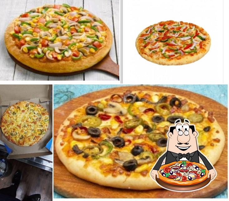 Try out pizza at Roms Pizza sanjay nagar