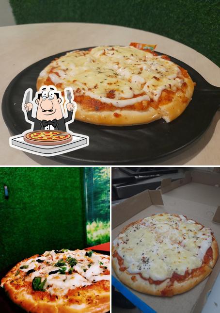 Get pizza at Nomad KB Cafe