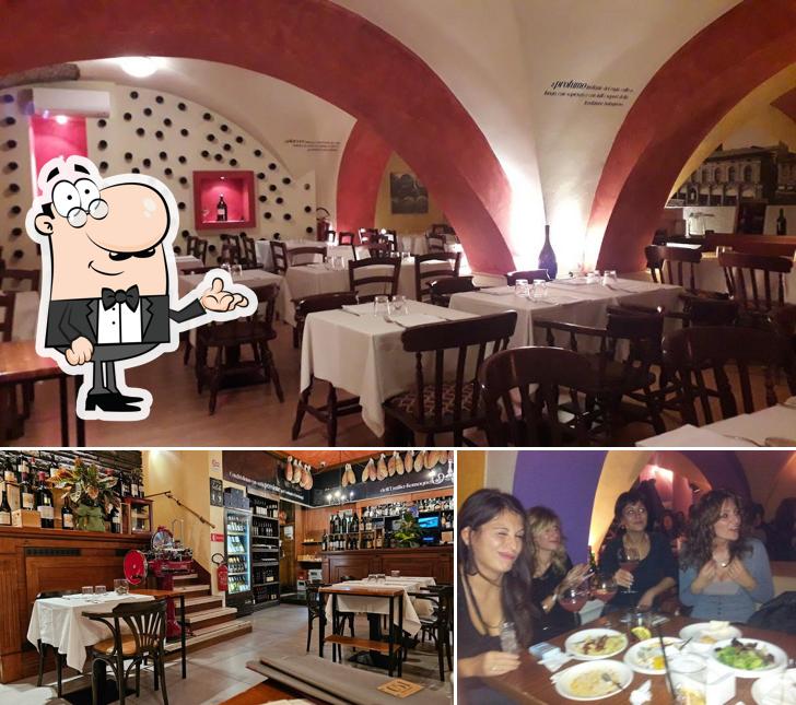 Dai un’occhiata alla foto che presenta la interni e tavolo da pranzo di 051 Osteria Piazza Maggiore