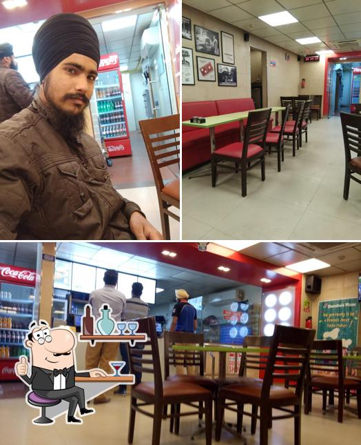 Take a seat at one of the tables at Domino's Pizza Abrol Nagar, Nawanshahr