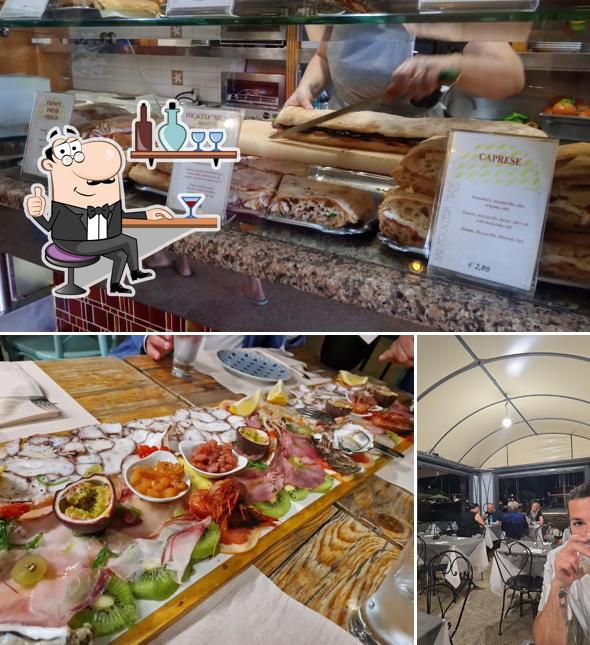Dai un'occhiata agli interni di Il Piccolo Lido Pizzeria