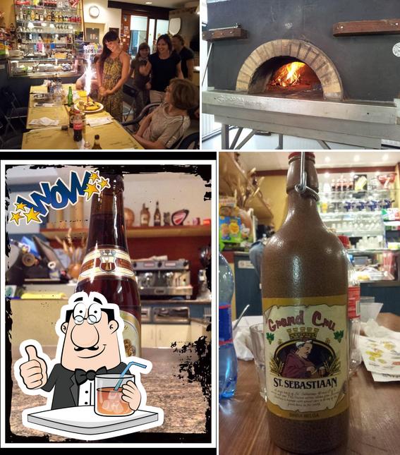 La immagine della bevanda e interni di Pizzeria L'angolo