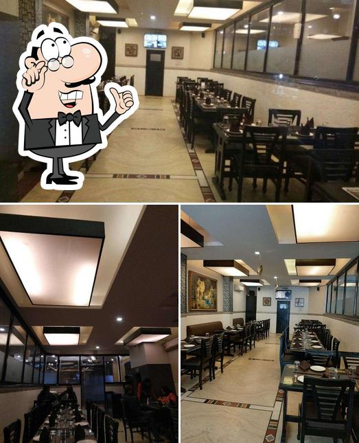 Take a seat at one of the tables at Siddharth Restaurant