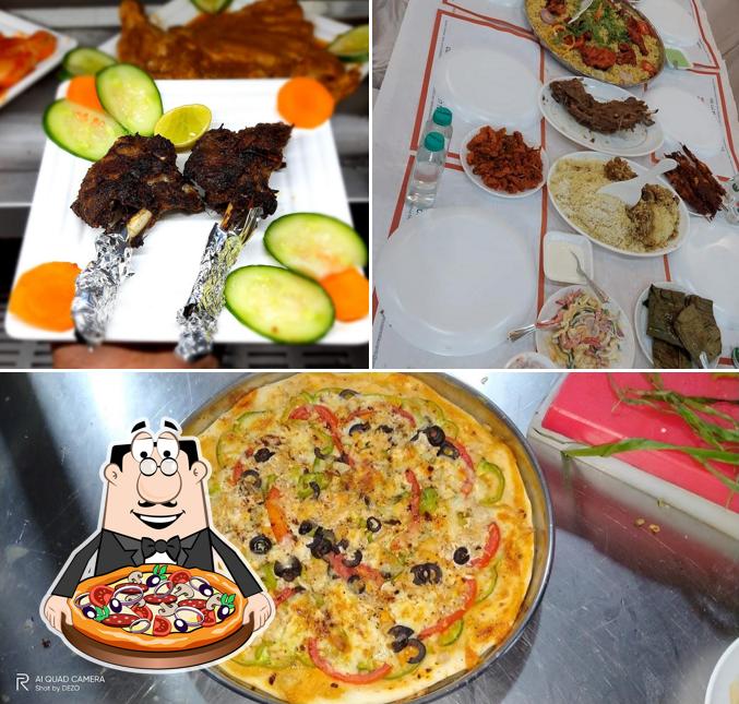 Get pizza at Rest House Restaurant & Caterers