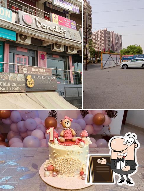 Check out the picture depicting exterior and food at Donalds pastry & Cake shop