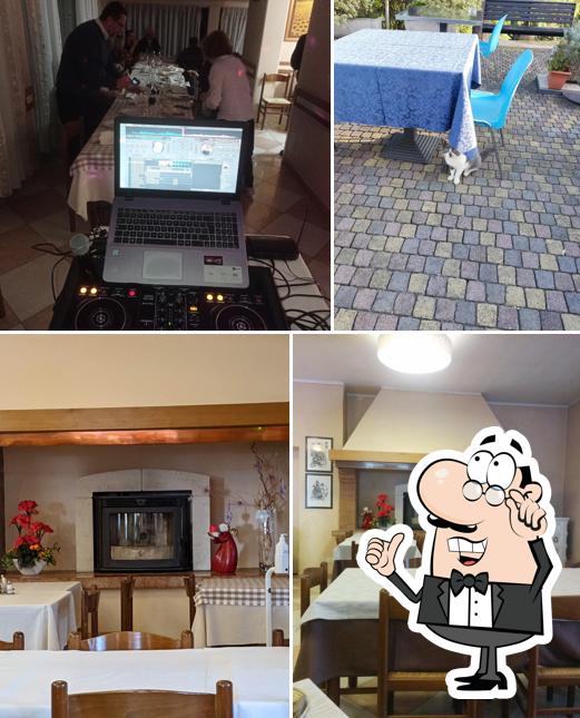 Dai un'occhiata agli interni di Osteria al Cacciatore