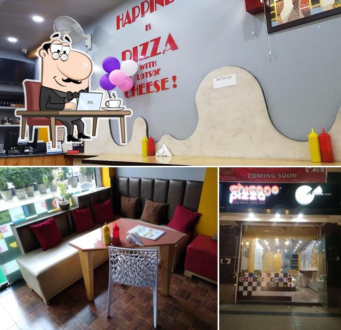 Take a seat at one of the tables at Chicago Pizza Indrapuram Best Pizza in Indrapuram