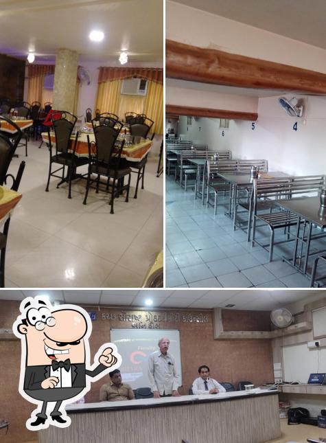 Take a seat at one of the tables at Chetna Dining Hall & Restaurant