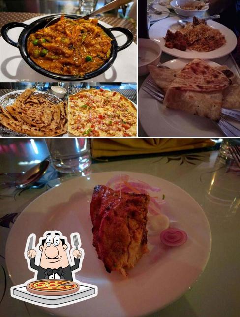 Get pizza at Veg Darbar
