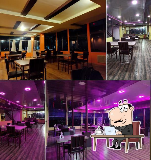 Take a seat at one of the tables at The MB's Rooftop Inn