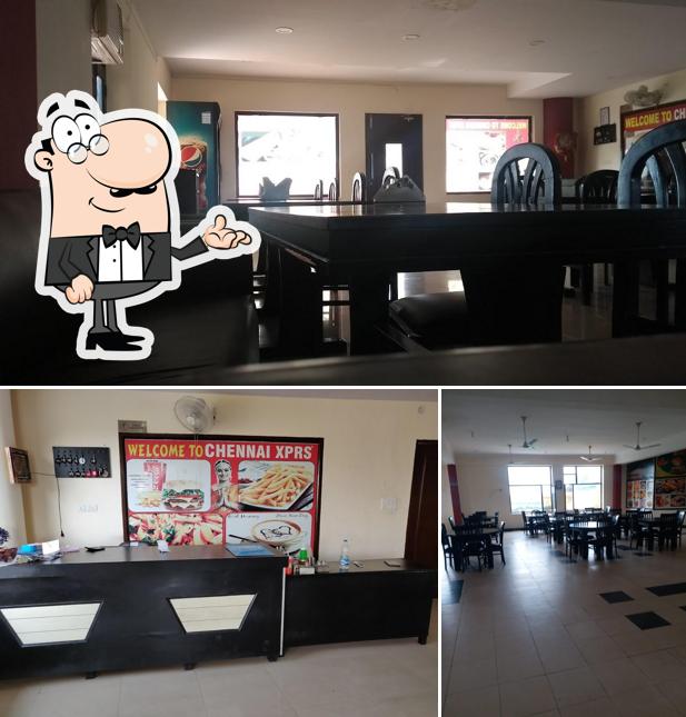 This is the image showing interior and dining table at AJIT PUNJABI DHABA