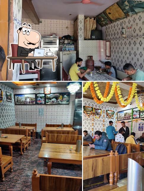 Take a seat at one of the tables at Chauhan Restaurant