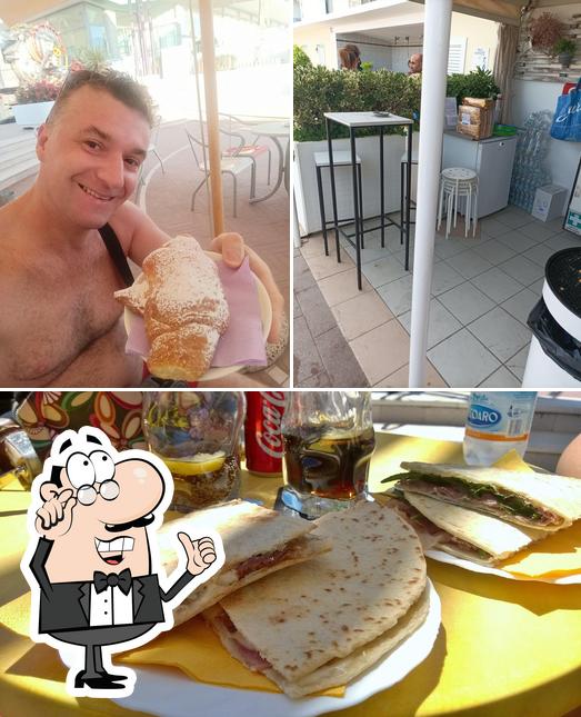 Questa è la immagine che raffigura la interni e cibo di Bar Nives