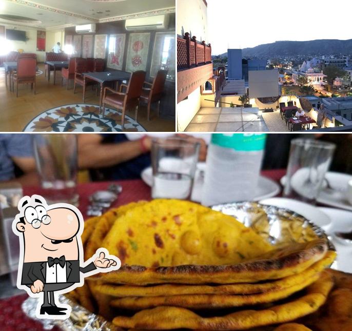 This is the picture depicting interior and beverage at Rajwada Restaurant