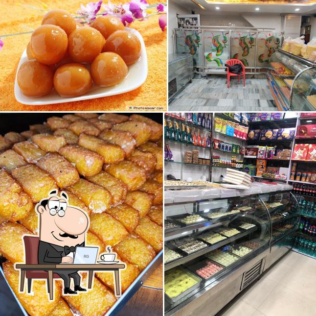 Take a look at the image showing interior and food at Luxmi sweet shop