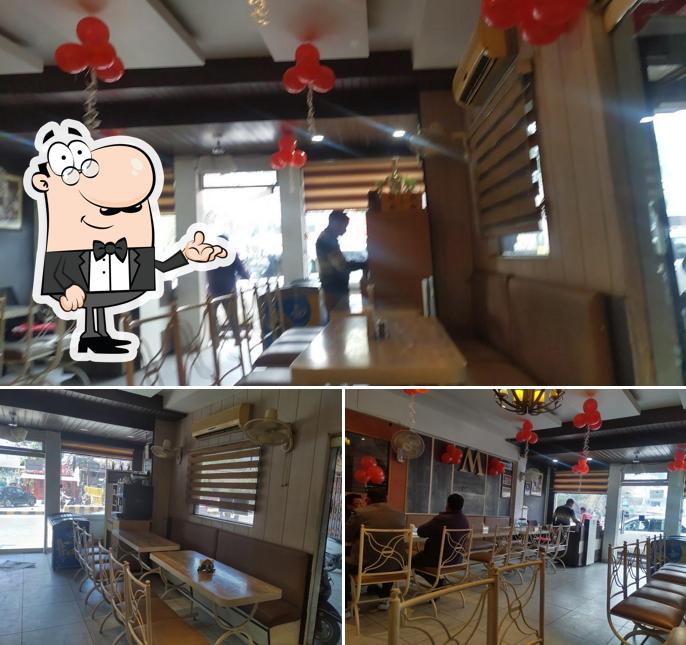 Take a seat at one of the tables at Moti Mahal Restaurant