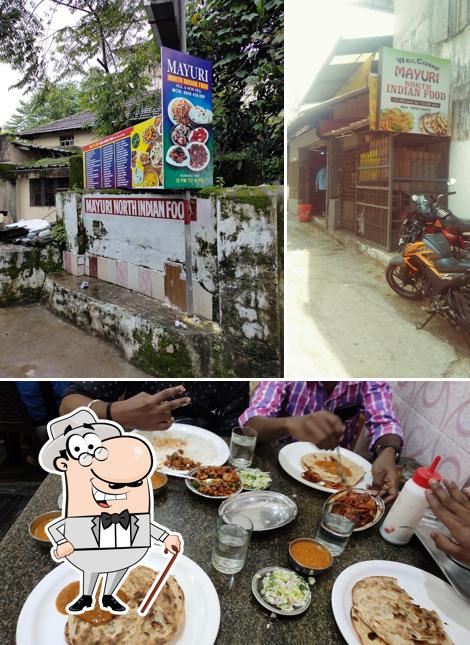 Among various things one can find exterior and dining table at Mayuri North Indian Food