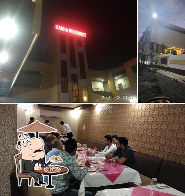The picture of exterior and dining table at HOTEL KANHA RESIDENCY