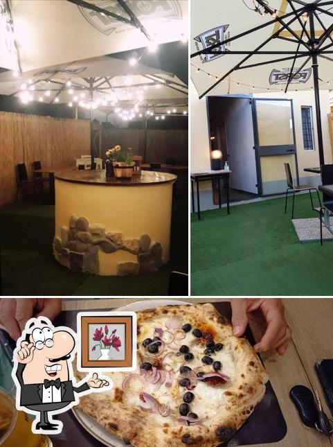 Guarda la immagine che mostra la interni e cibo di La biblioteca della pizza