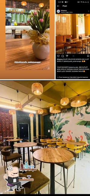 Take a seat at one of the tables at Destiny Cafe Sudama Nagar