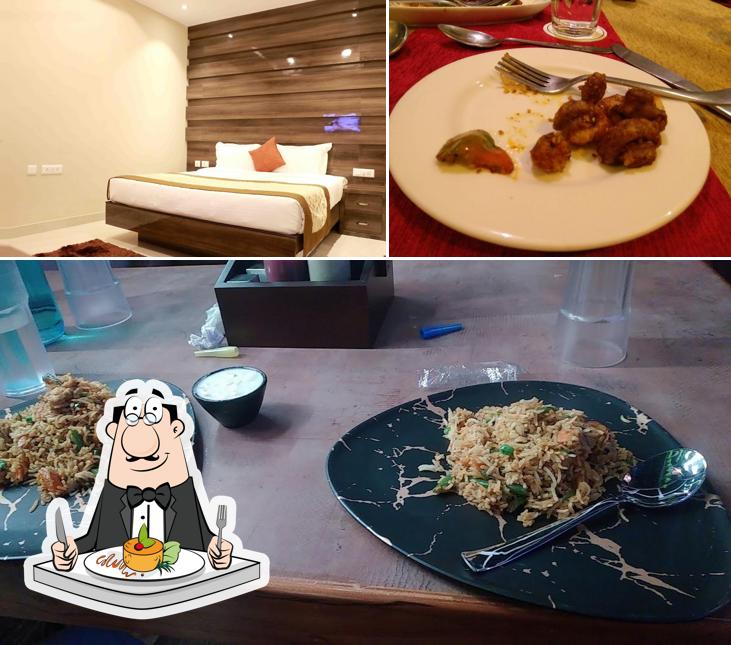 The image of food and interior at Grand Arsh Residency