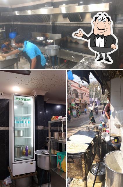 Take a seat at one of the tables at Sree Purna Tiffin Center