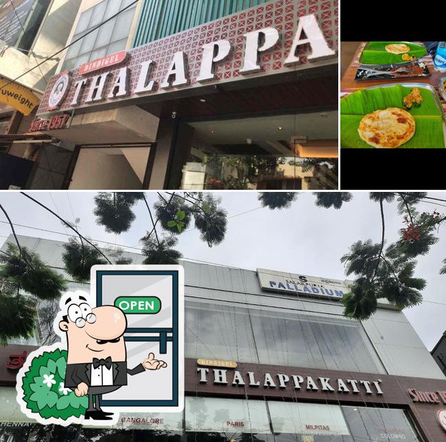 Among various things one can find exterior and dining table at Dindigul Thalappakatti Restaurant