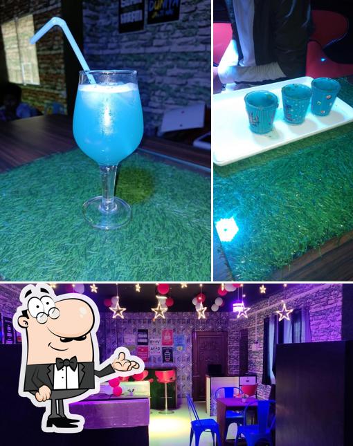 Check out the image depicting interior and alcohol at The Dark Cafe