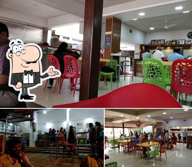 Take a seat at one of the tables at Dosa Point Since 1999