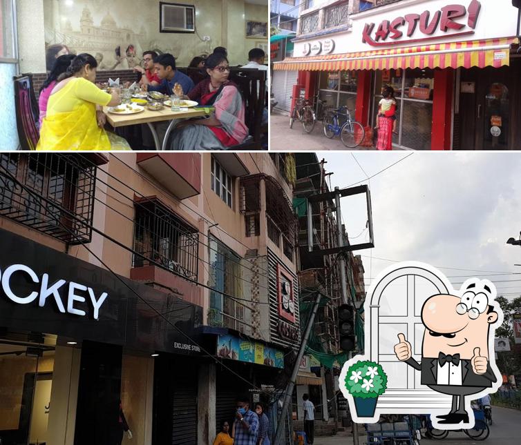 The picture of exterior and dining table at Kasturi Restaurant