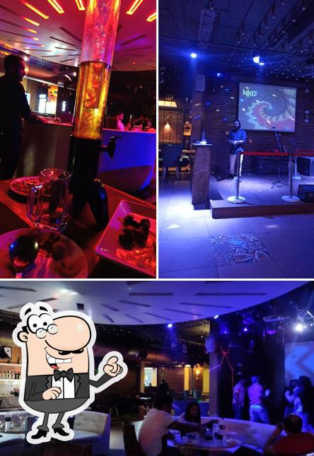 Take a seat at one of the tables at Sheesha Restaurant SkyClub & Lounge