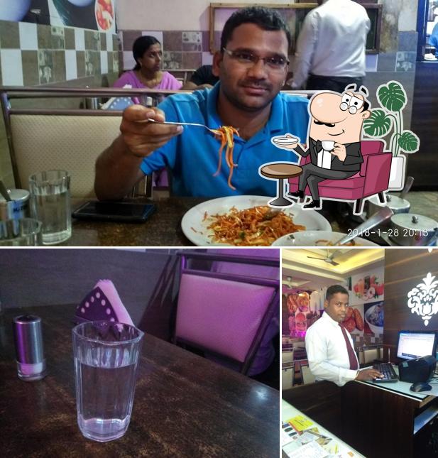 Take a seat at one of the tables at MahaLaxmi Krupa Pure Veg Restaurant