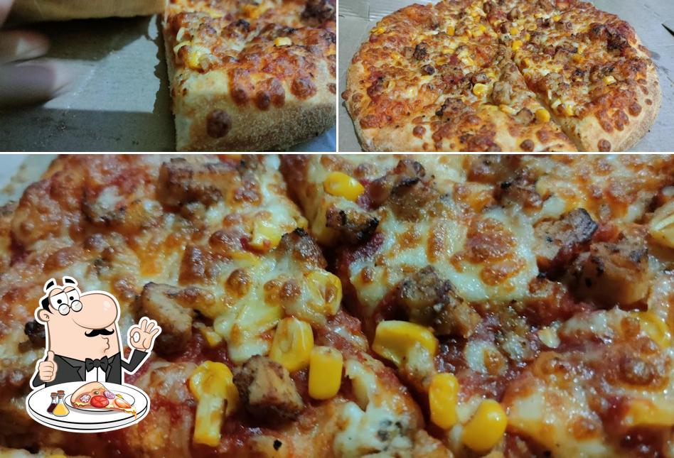 Try out pizza at Ramdhenu Restaurant