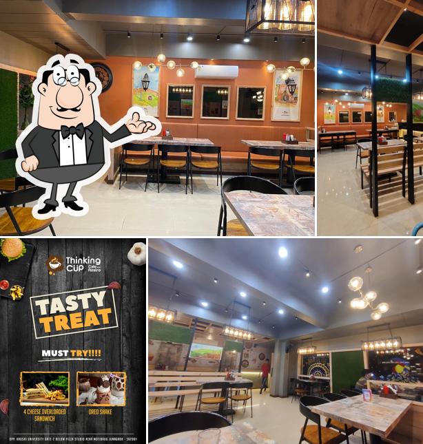 Take a seat at one of the tables at Thinking Cup Junagadh
