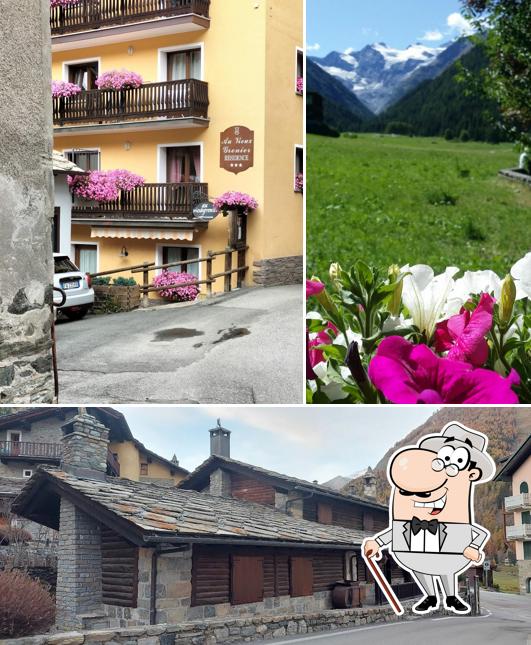 Puoi goderti l'aria fresca da seduto all'esterno di Residence Au Vieux Grenier